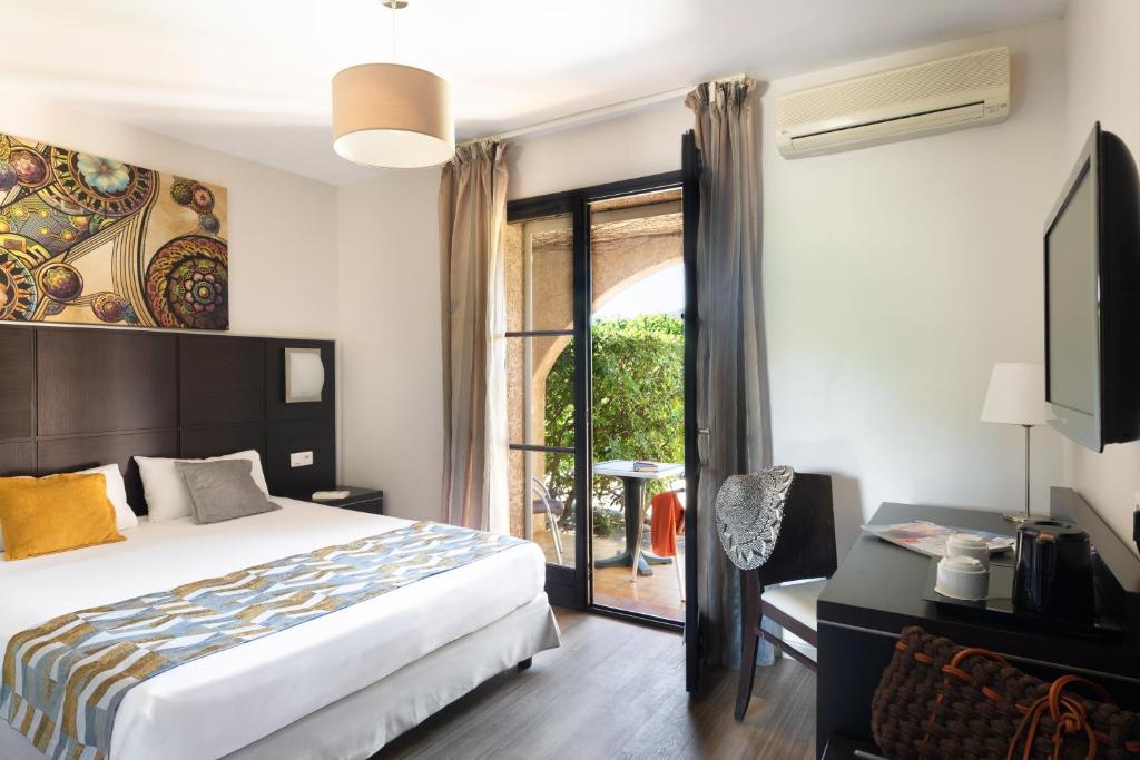 Postel nebo postele na pokoji v ubytování Hotel U Ricordu & Spa