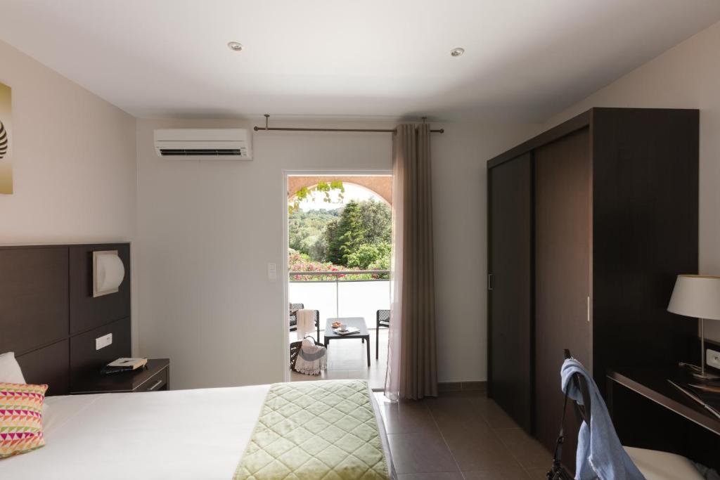 Postel nebo postele na pokoji v ubytování Hotel U Ricordu & Spa