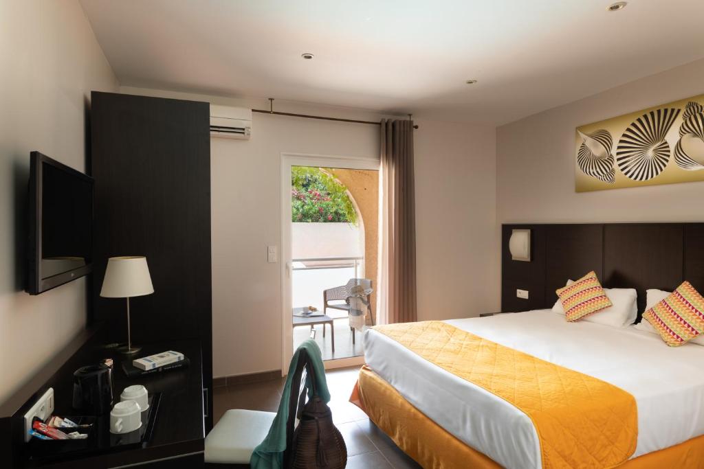 Postel nebo postele na pokoji v ubytování Hotel U Ricordu & Spa