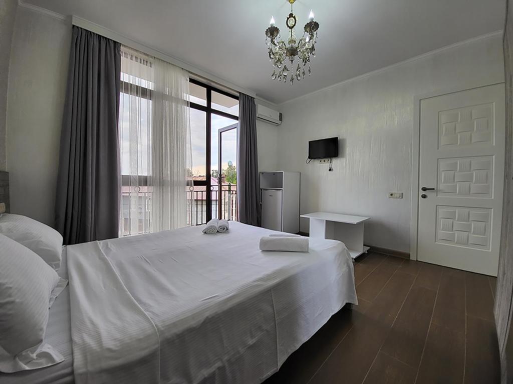 Postel nebo postele na pokoji v ubytování MITE Hotel