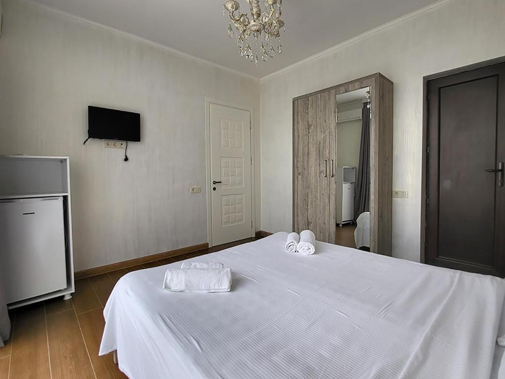 Postel nebo postele na pokoji v ubytování MITE Hotel