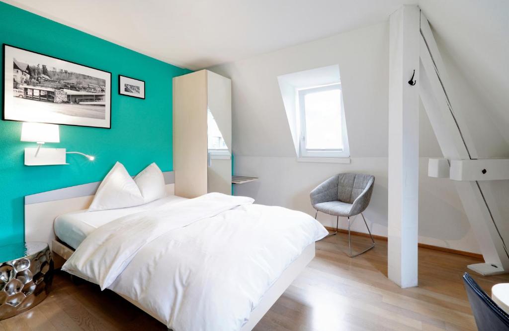 Postel nebo postele na pokoji v ubytování Hotel Zugertor