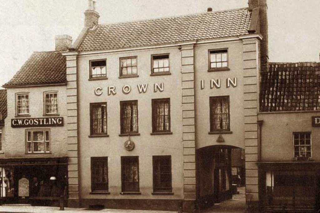 an old black and white photo of a building at The Crown Fakenham in Fakenham