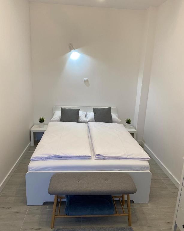 Posteľ alebo postele v izbe v ubytovaní Apartamenty "CENTRUM" Mrągowo Mazury