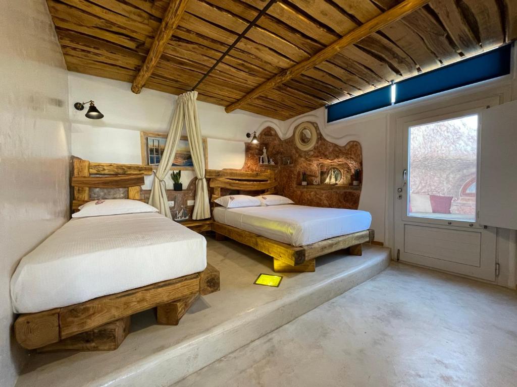 Postel nebo postele na pokoji v ubytování Hada seaside apartment