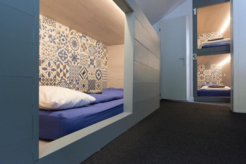 Postel nebo postele na pokoji v ubytování Vert Lodge Chamonix