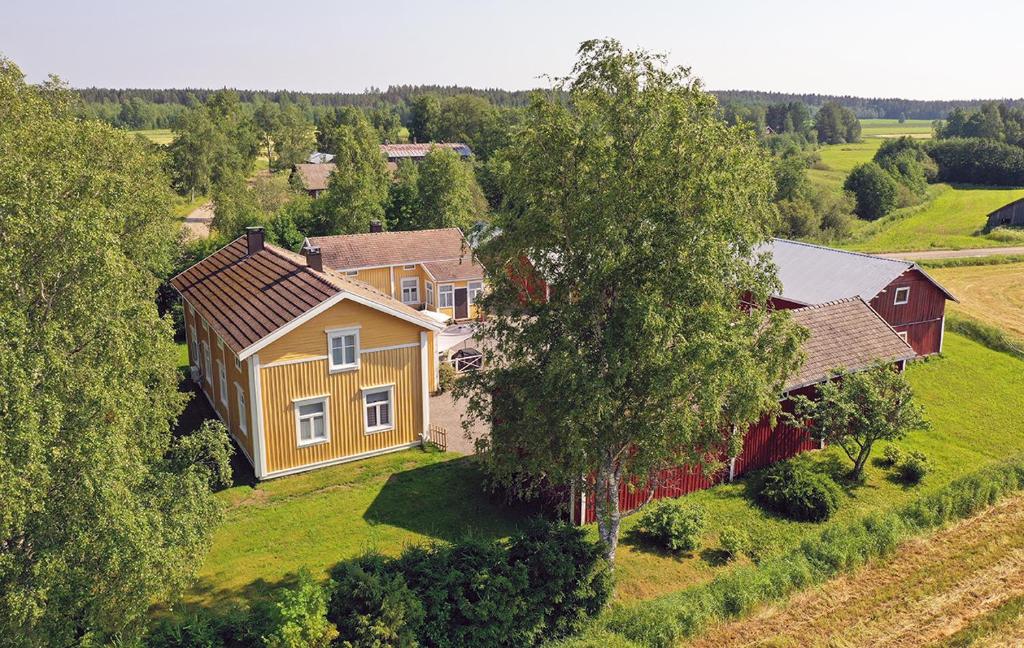 an aerial view of a house in a field at Villa Miilia maalaismajoitus ja spa in Karijoki