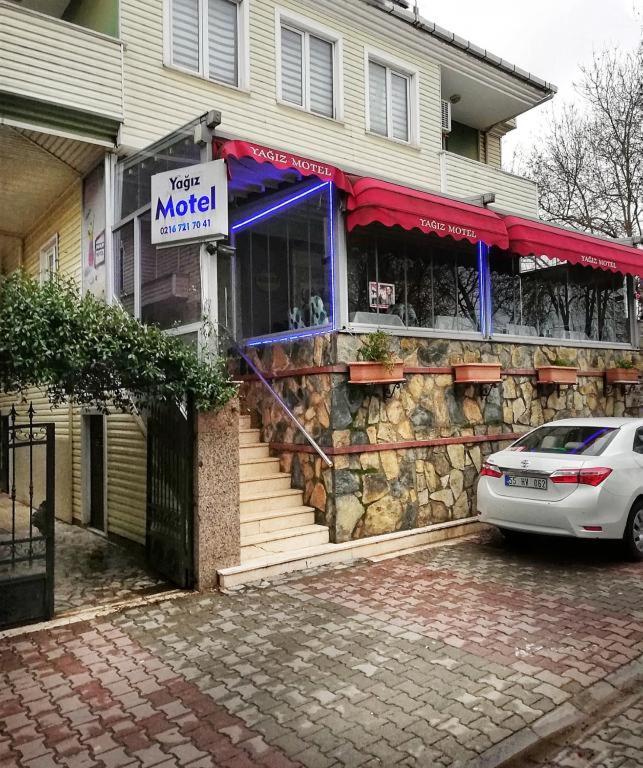 a car parked in front of a miod store at Yağız İndigo Blue in Şile