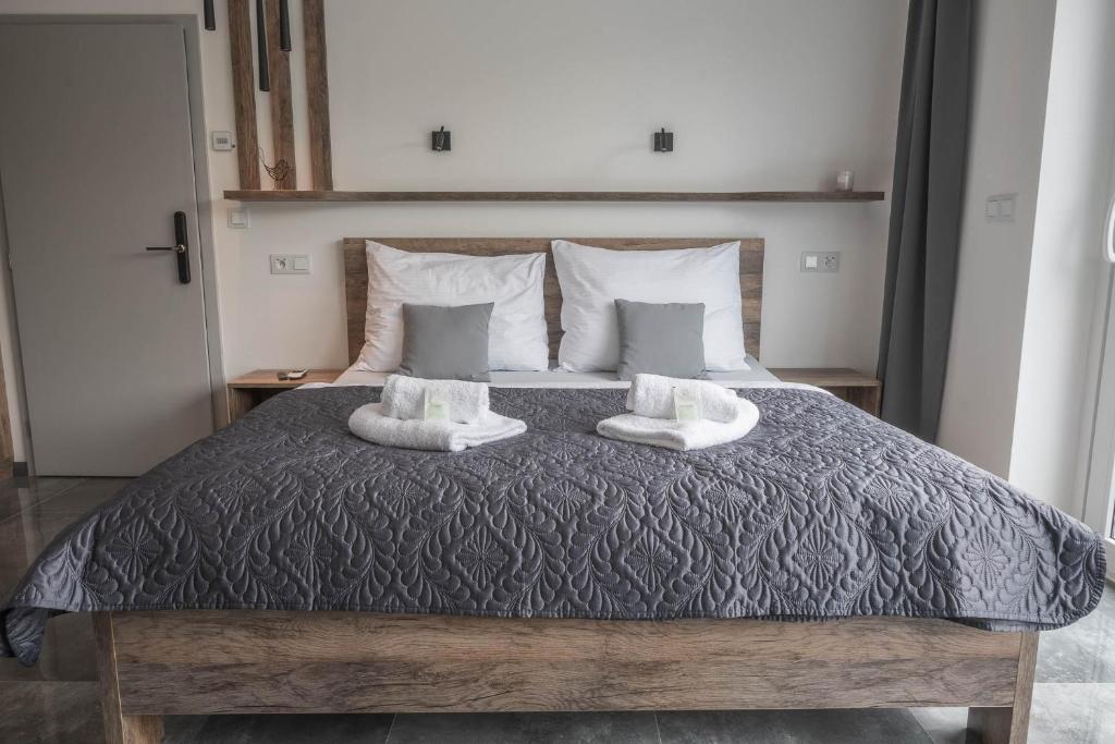Łóżko lub łóżka w pokoju w obiekcie Veltlin Bed & Wine