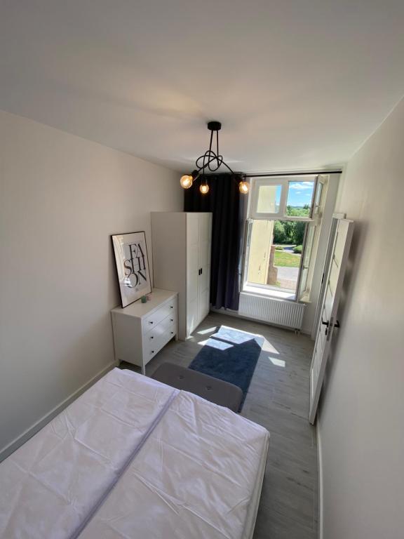 Posteľ alebo postele v izbe v ubytovaní Apartamenty "CENTRUM" Mrągowo Mazury