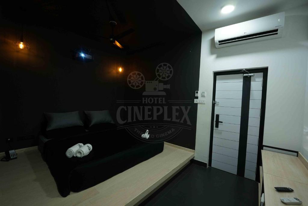 Postel nebo postele na pokoji v ubytování Hotel Cineplex