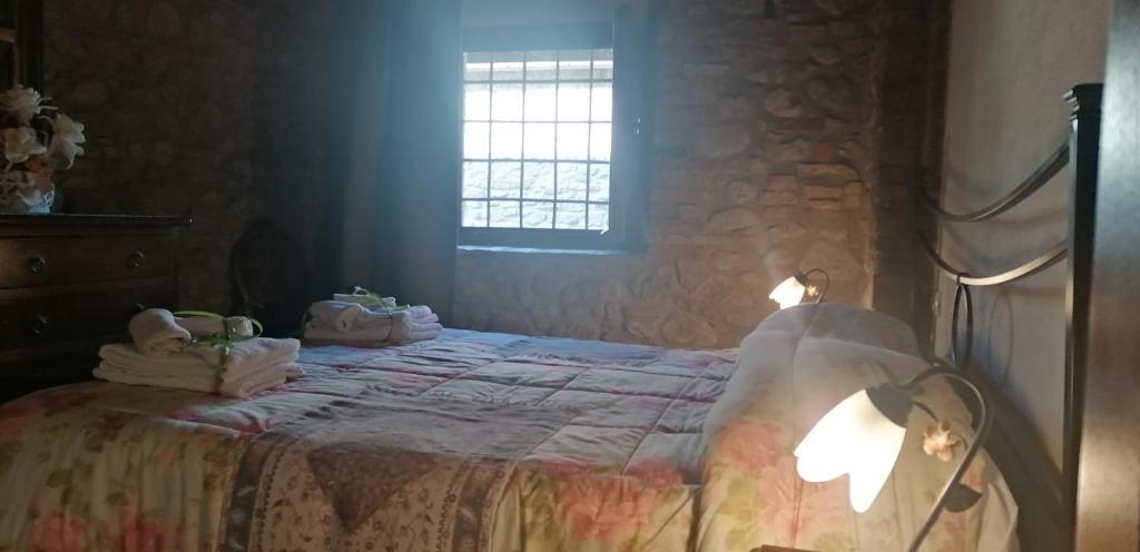 Ein Bett oder Betten in einem Zimmer der Unterkunft Agriturismo La Mirandola