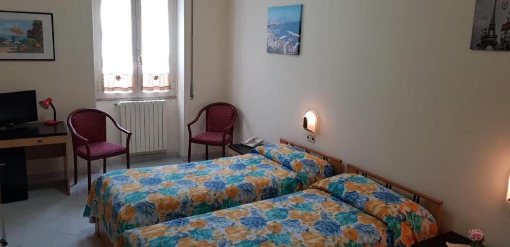 Ένα ή περισσότερα κρεβάτια σε δωμάτιο στο Hotel Desìo