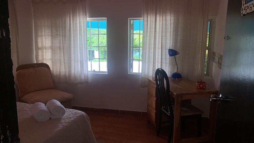 Postel nebo postele na pokoji v ubytování Hostal familiar Villa Nome
