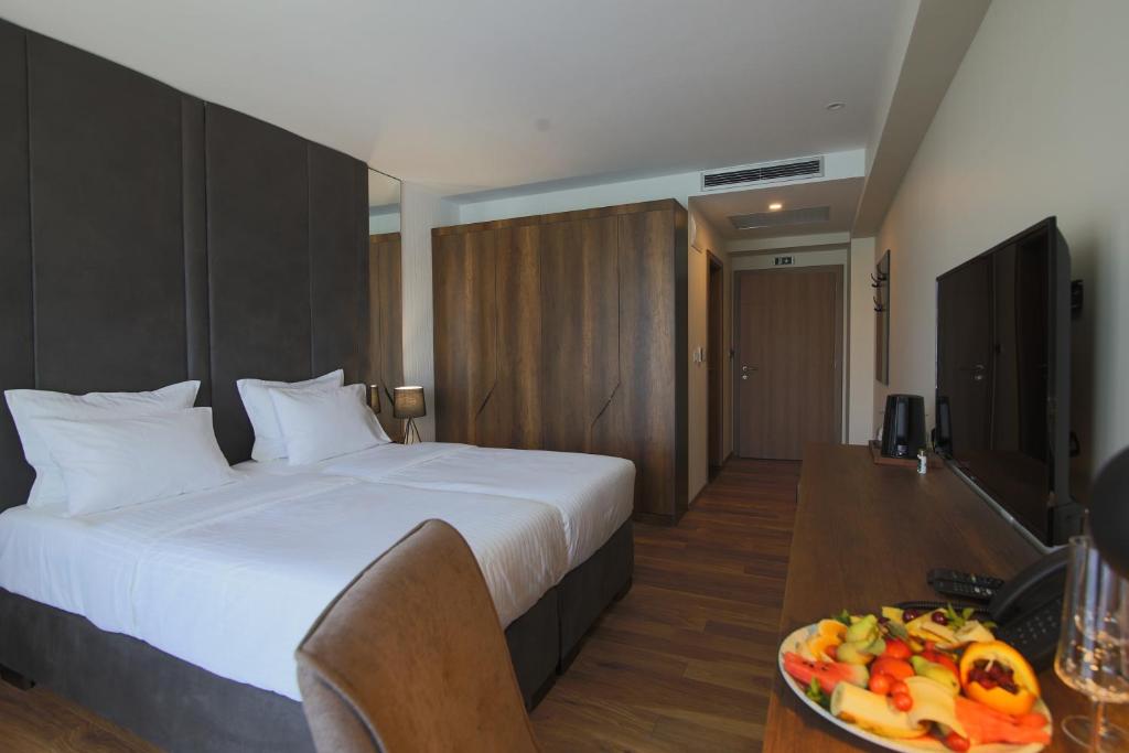 Postel nebo postele na pokoji v ubytování Glorius Hotel