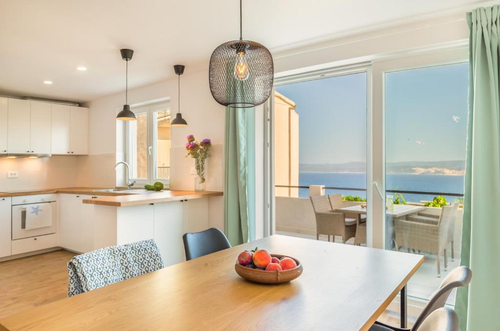 Kuchyň nebo kuchyňský kout v ubytování Adris apartments