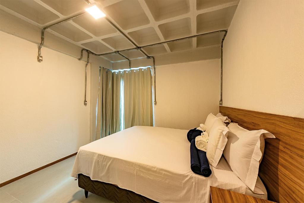 Postel nebo postele na pokoji v ubytování Antiquus ApartHotel