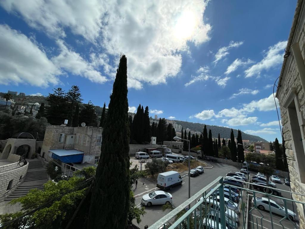 a view of a parking lot with a tree at Diamond Luxury Apartment - Haifa in Haifa
