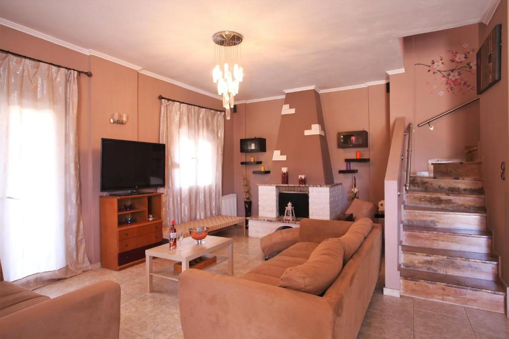 TV a/nebo společenská místnost v ubytování Alice Maisonette & Studios