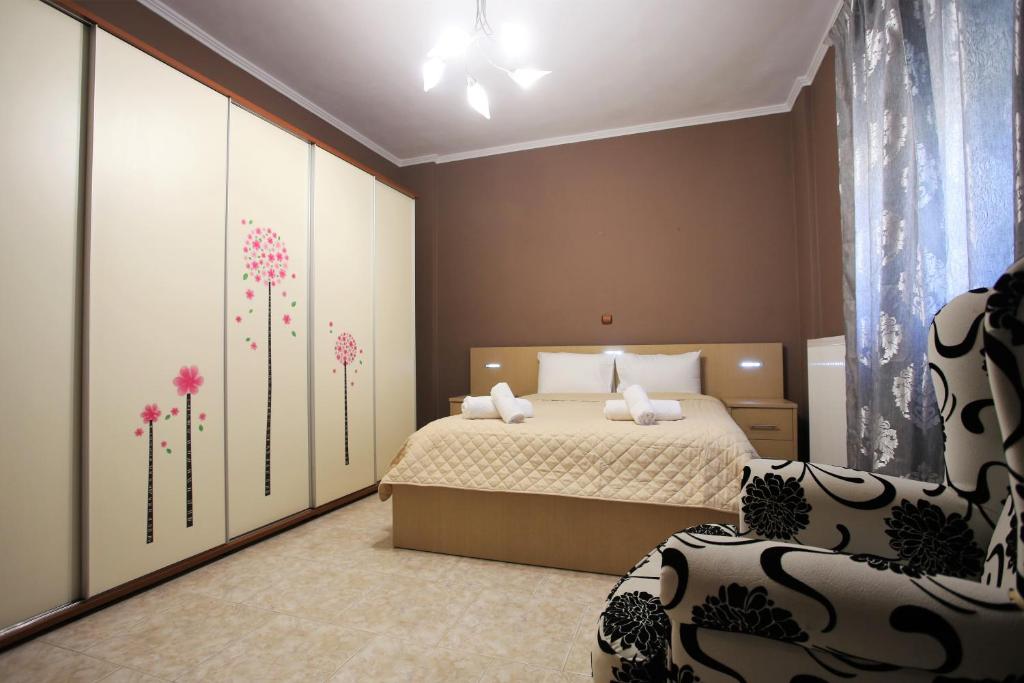 Postel nebo postele na pokoji v ubytování Alice Maisonette & Studios
