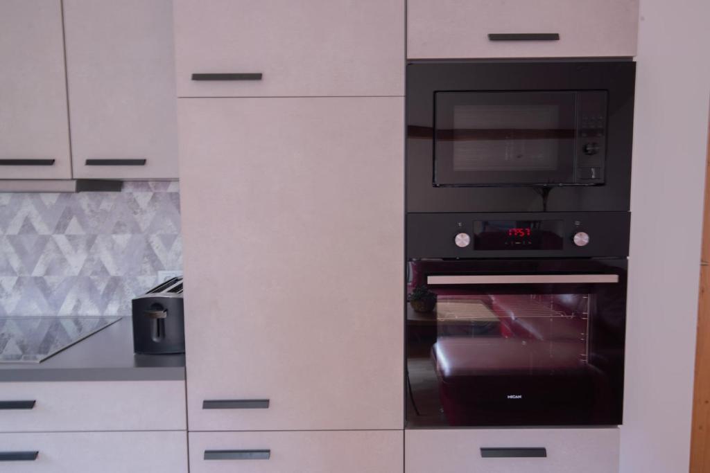 Kuchyň nebo kuchyňský kout v ubytování "Haus am Illufer" Ihr Smart-Alpin-Home in Bludenz
