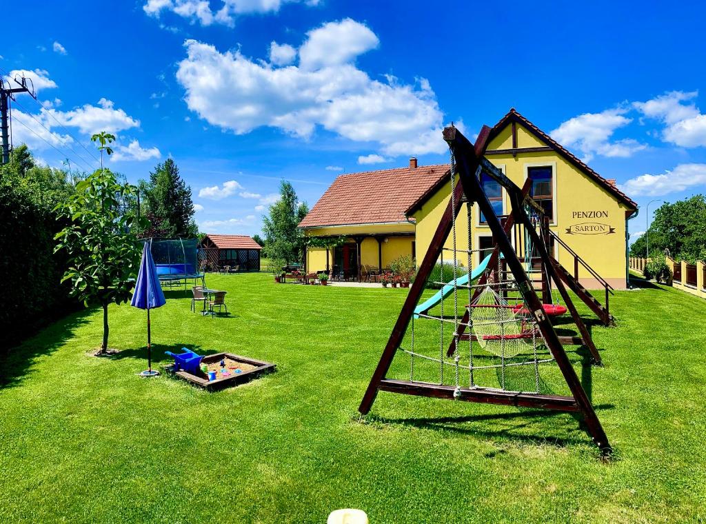 a playground in the yard of a house at Penzion Sarton in Lukov