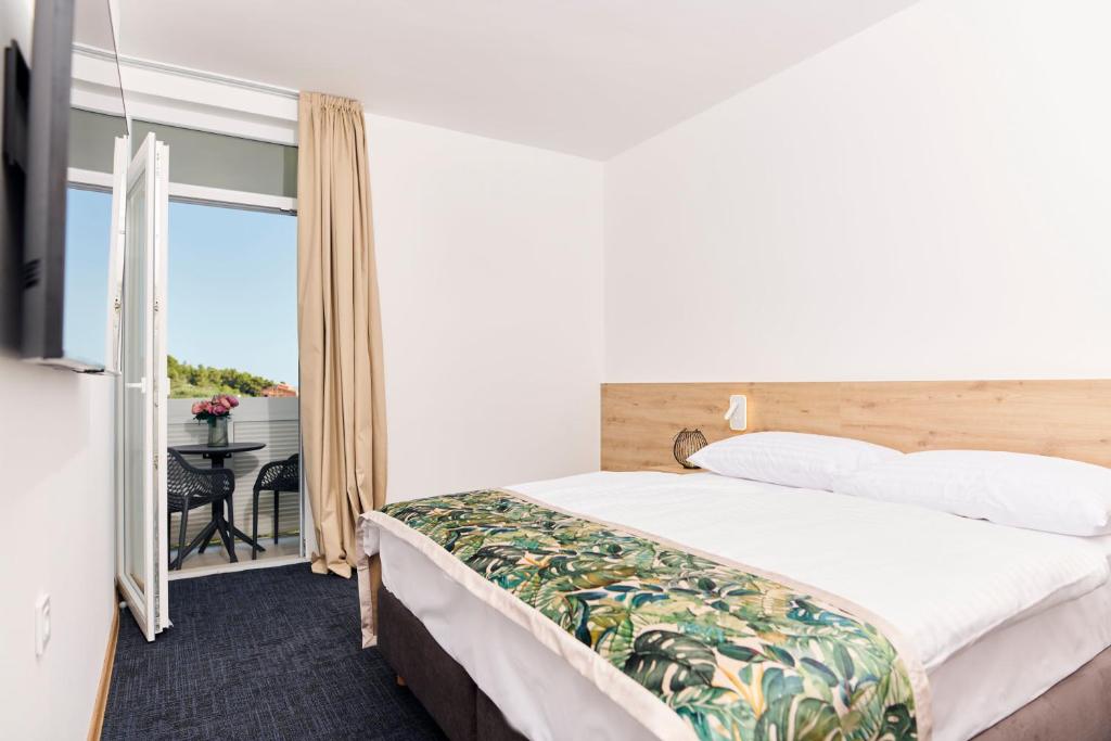 Postel nebo postele na pokoji v ubytování Colentum Resort Murter