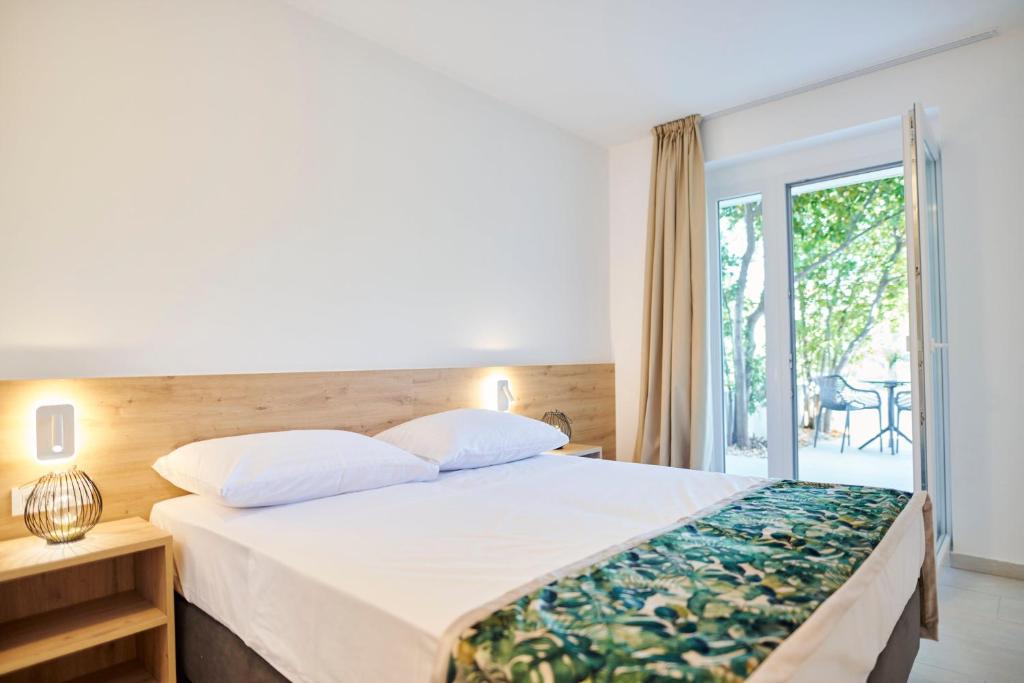 Postel nebo postele na pokoji v ubytování Colentum Resort Murter