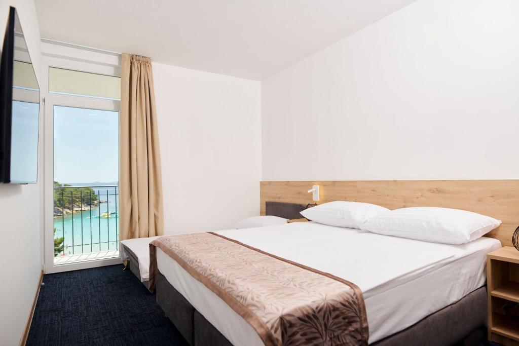 Postel nebo postele na pokoji v ubytování Colentum Resort Murter