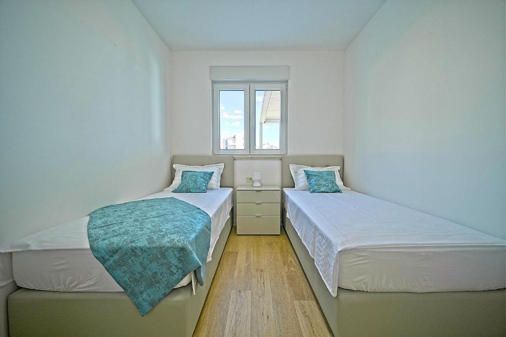 Posteľ alebo postele v izbe v ubytovaní Exclusive Makarska Apartment Aurora