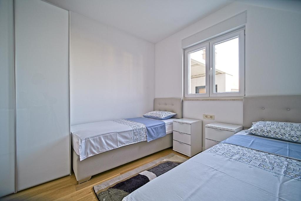 Posteľ alebo postele v izbe v ubytovaní Exclusive Makarska Apartment Aurora