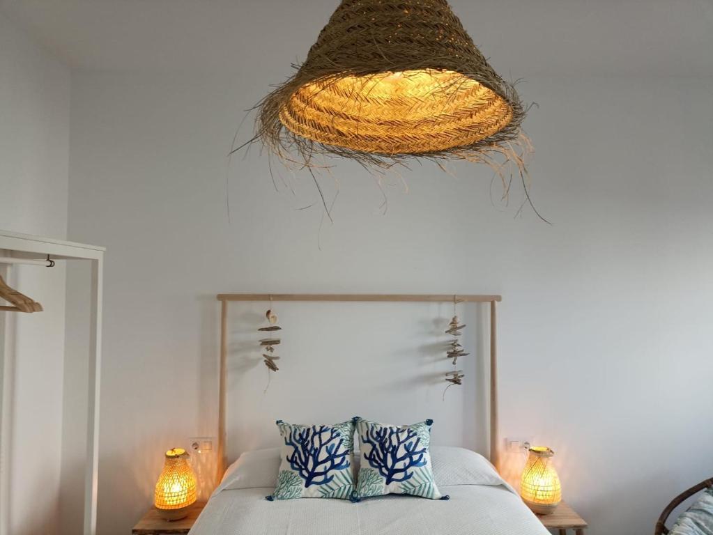 A bed or beds in a room at Mirador de Trafalgar Conil