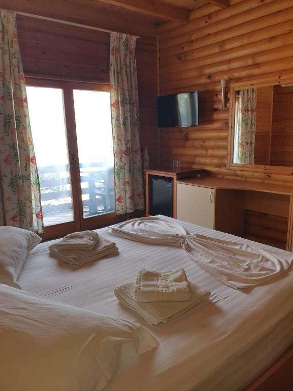 Postel nebo postele na pokoji v ubytování Hotel Adriatik 2