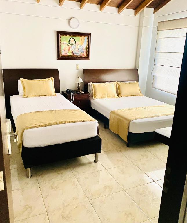 Postel nebo postele na pokoji v ubytování Hotel Palma 70