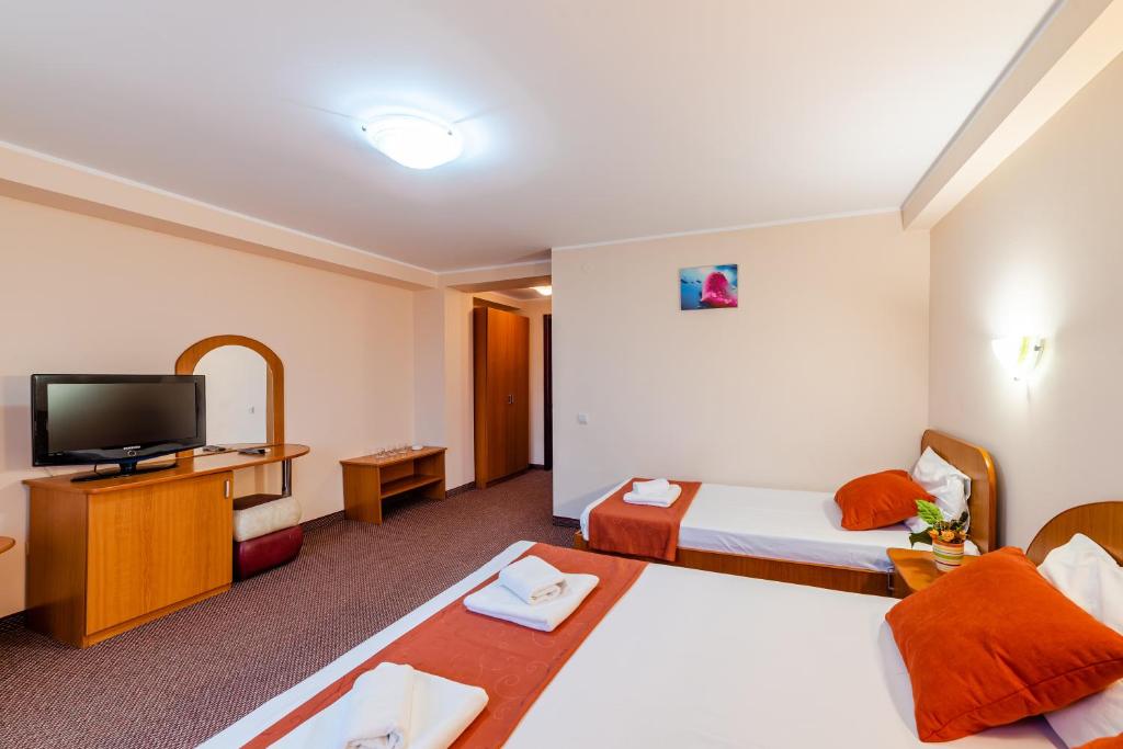 TV a/nebo společenská místnost v ubytování Hotel Giulia