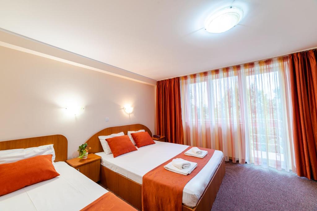 Postel nebo postele na pokoji v ubytování Hotel Giulia