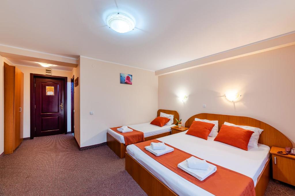 Postel nebo postele na pokoji v ubytování Hotel Giulia