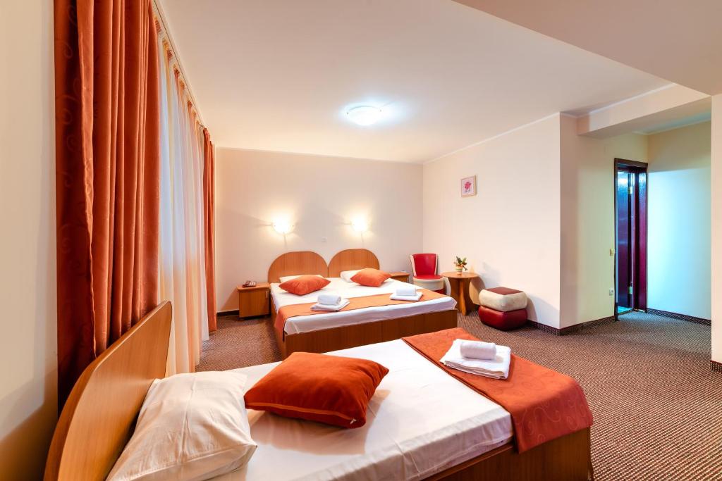 Postel nebo postele na pokoji v ubytování Hotel Giulia