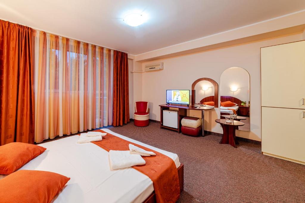 Postel nebo postele na pokoji v ubytování Hotel Giulia