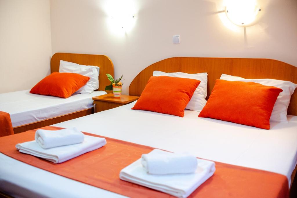 Postel nebo postele na pokoji v ubytování Hotel Giulia