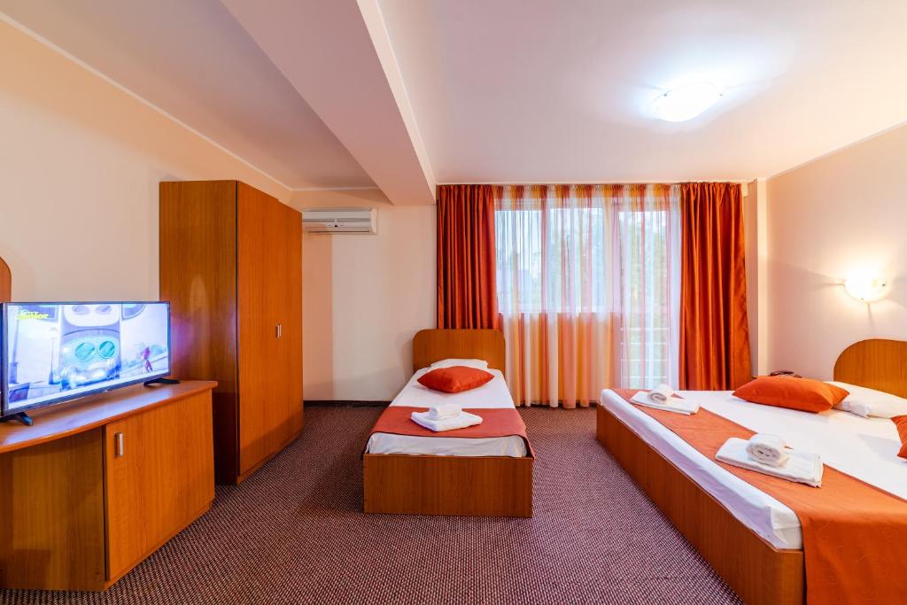 TV a/nebo společenská místnost v ubytování Hotel Giulia