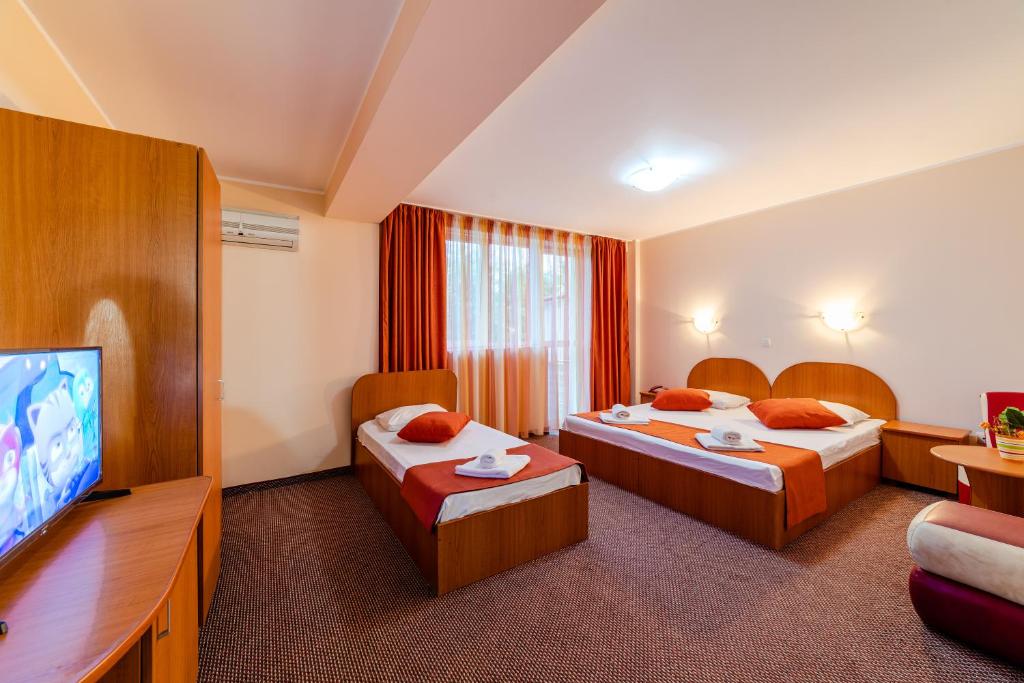 Postel nebo postele na pokoji v ubytování Hotel Giulia