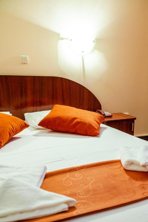 Postel nebo postele na pokoji v ubytování Hotel Giulia