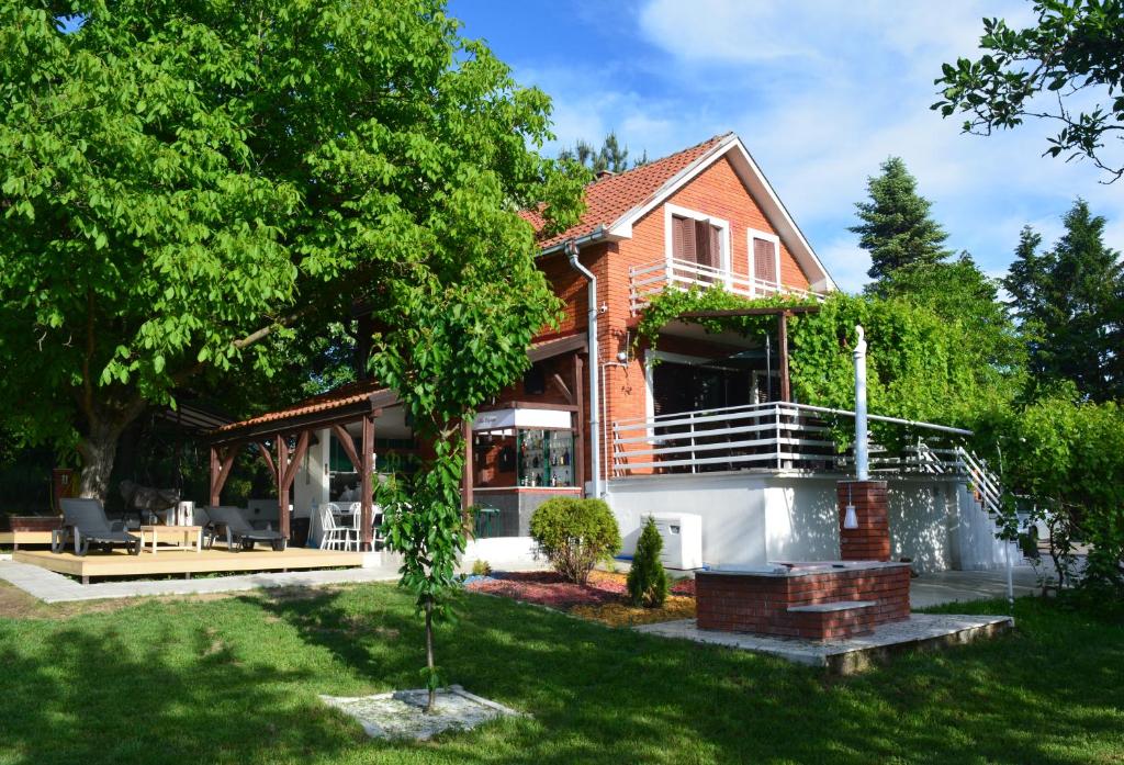 a house with a porch and a patio at Vila Dijana - Avala in Belgrade