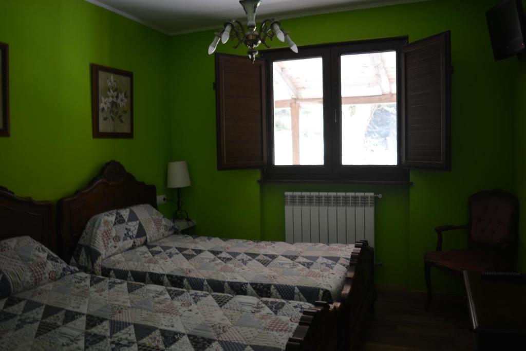 A bed or beds in a room at el calero