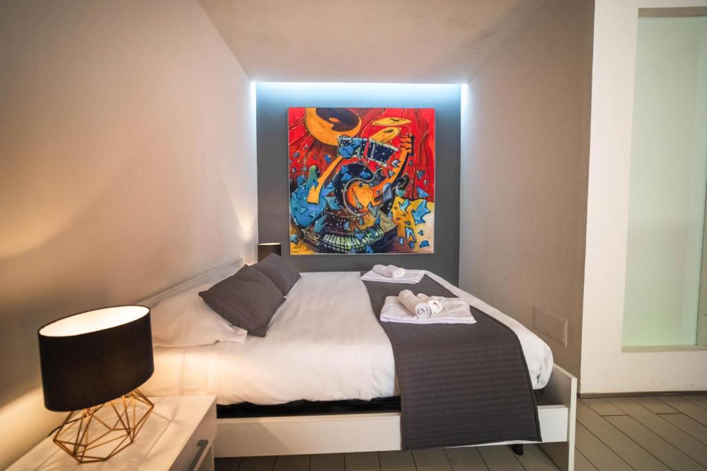 Łóżko lub łóżka w pokoju w obiekcie Villino Erminia - Seaside Art b&b