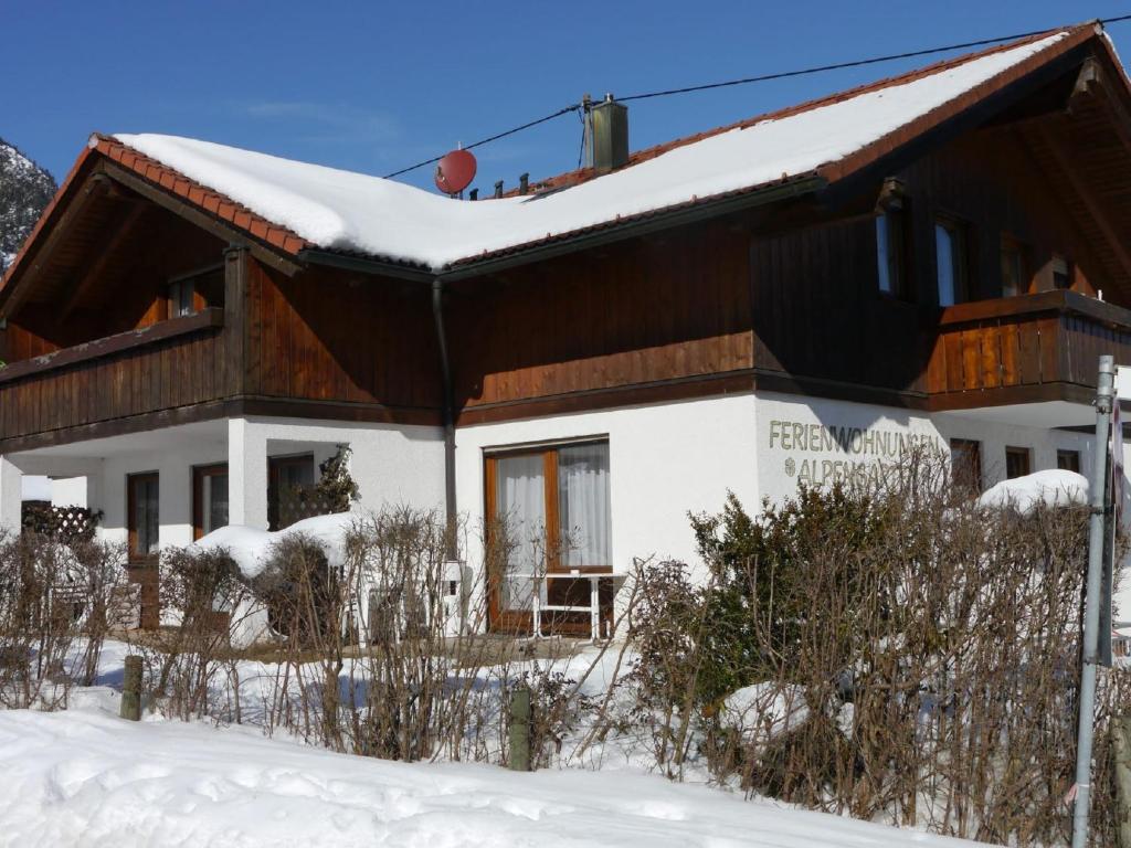 a house in the snow with snow at Landhaus am Breitenberg in Pfronten