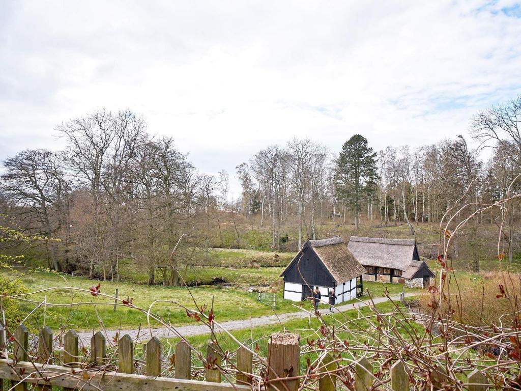 an old house in the middle of a field at 2 person holiday home in Aakirkeby-By Traum in Vester Sømarken