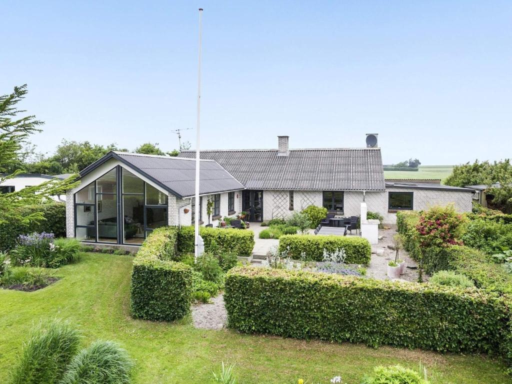 a house with a garden in front of it at 8 person holiday home in Vesløs-By Traum in Vesløs