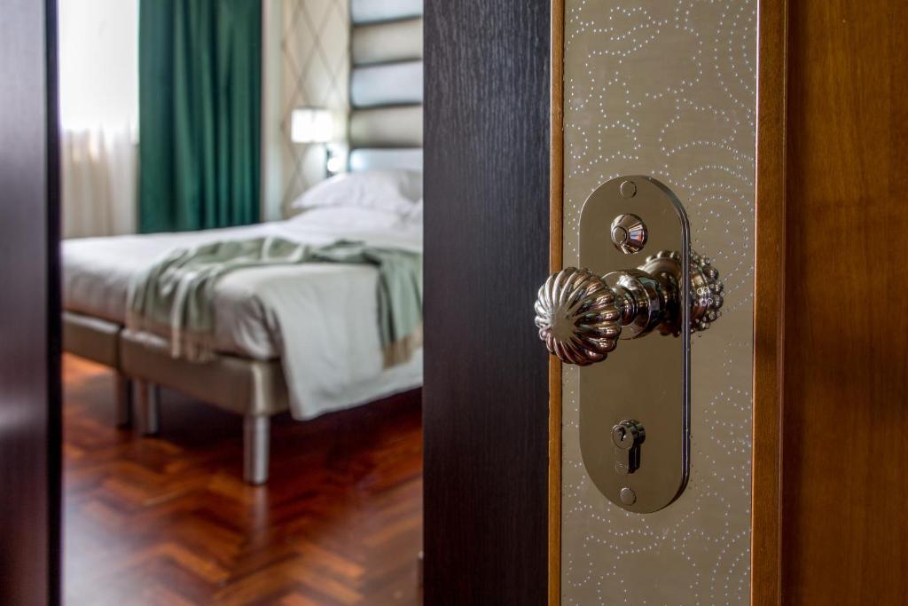 Postel nebo postele na pokoji v ubytování Enea Hotel Pomezia